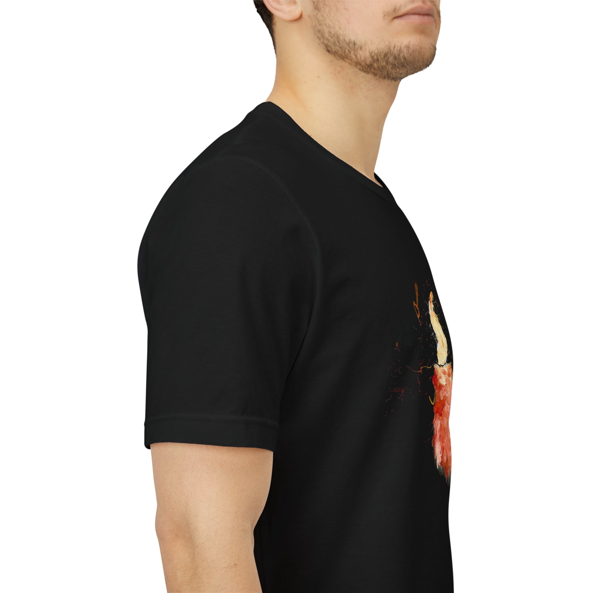 A close side view of a man wearing the black t-shirt, the painted candle running down the right edge of the frame across his chest.