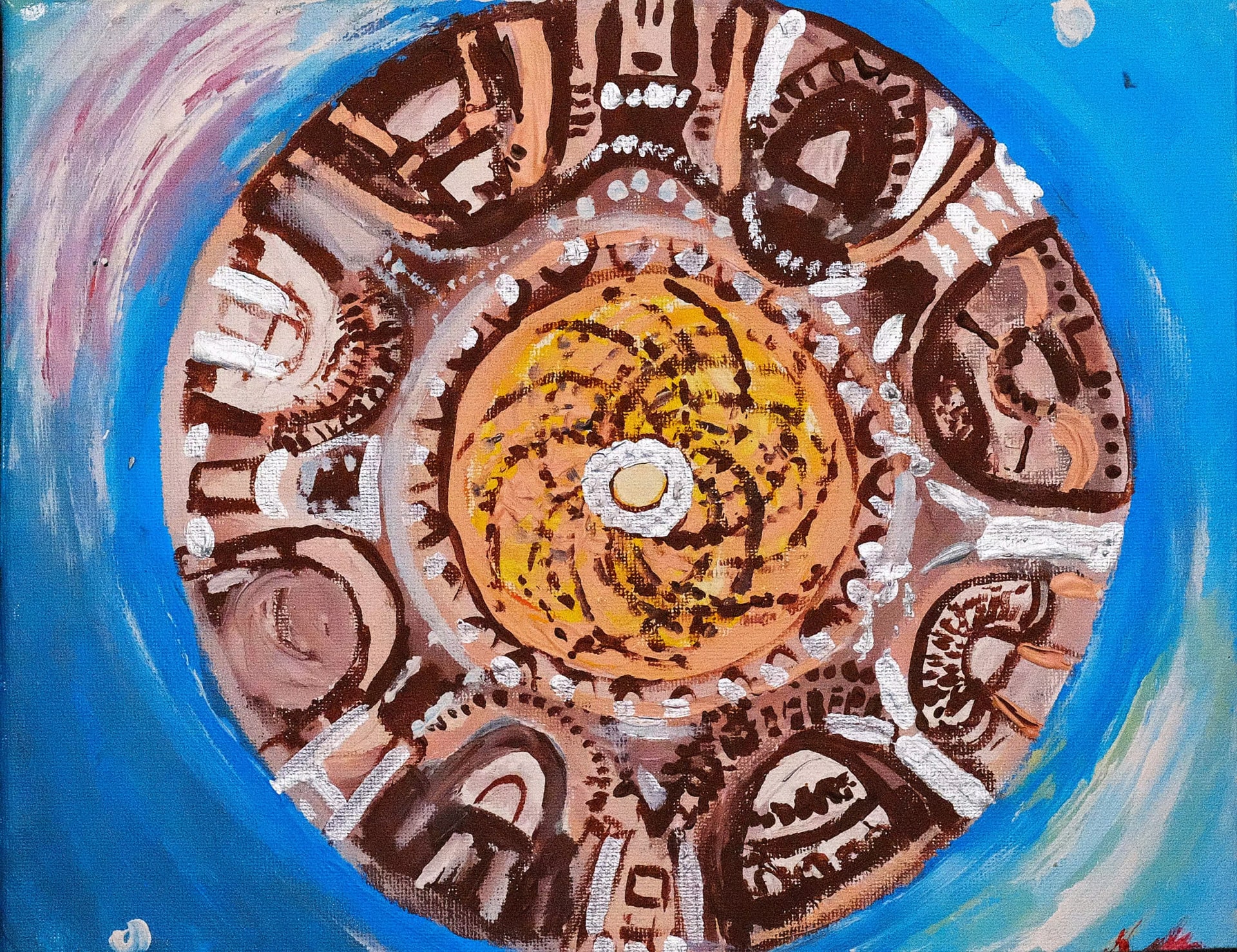 Looking straight up into a domed ceiling, its ring of arches and ornament painted in browns and terracotta with white highlights. A golden disc fills the centre and brilliant blue surrounds the dome on every side.